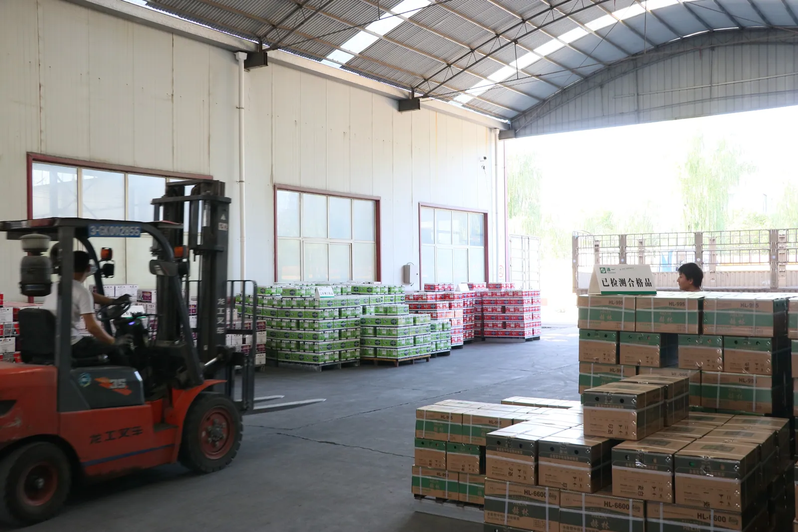 Forklift and cartons in the factory dispatch area